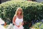 Kathy at Gorge Bridge in front of flowers