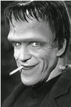 Fred Gwynne as Herman Munster enjoying a smoke