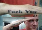 a tattoo that says fuck you when salute