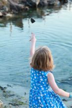 child throw stone little girl throwing water 59900573