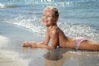 little girl lying sand near sea 60561692