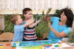 mom finger painting with kids