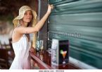 young woman knocking on closed bar bgcrj4