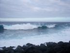 waves over black rocks 1